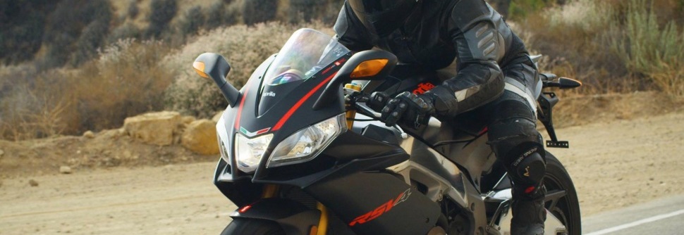 A man riding black motorbike