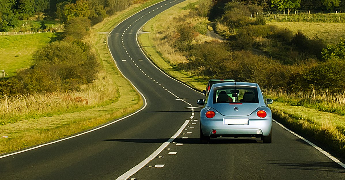 a blue car on the road