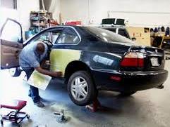 A man fixing a car