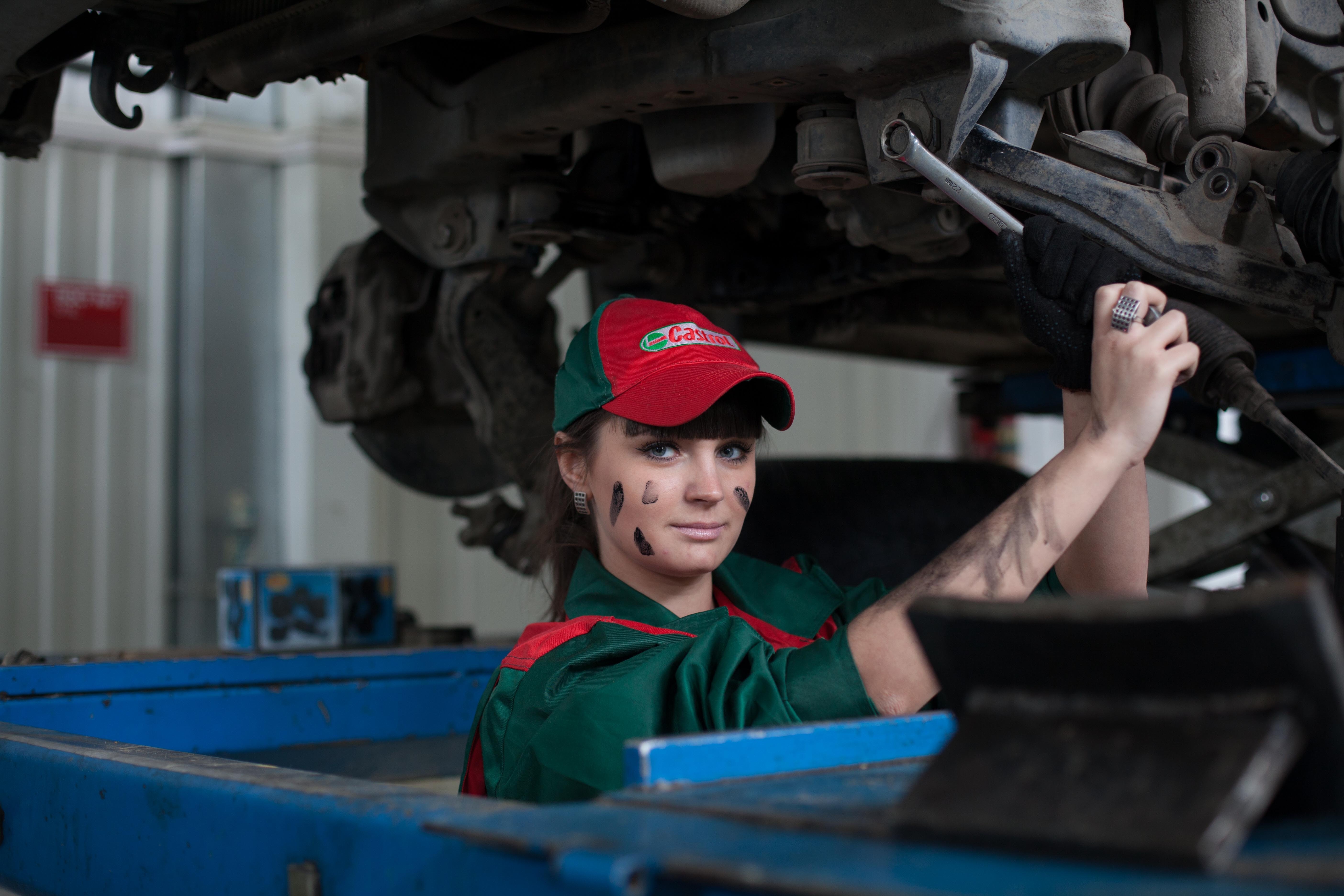girl fixing the car